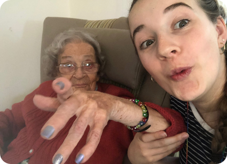 Summerlands | an image showing one of our residents and a member of our staff laughing and enjoying a conversation