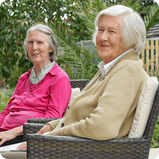 Summerlands | An image of two of our residents sat enjoying the sunshine