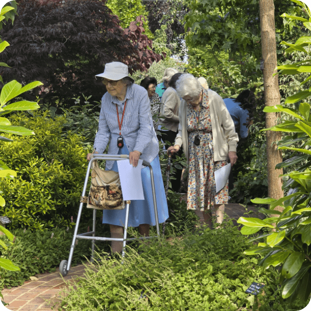 Summerlands | an image showing some of our residents taking a walk through our gardens