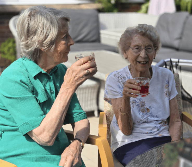 Summerlands | an image showing two of our residents enjoying refreshments outside