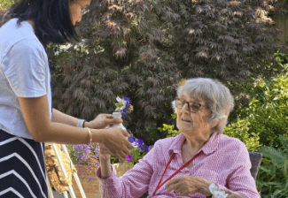 Summerlands | an image of a resident and member of staff communicating