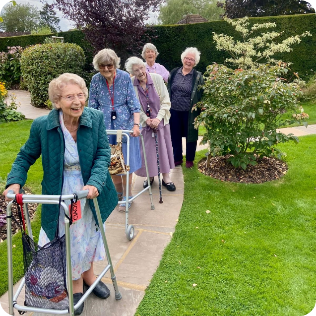 Summerlands | an image showing several of our residents walking around our gardens