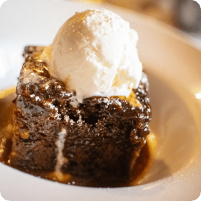 Summerlands | Mealtime image showing a sticky toffee pudding