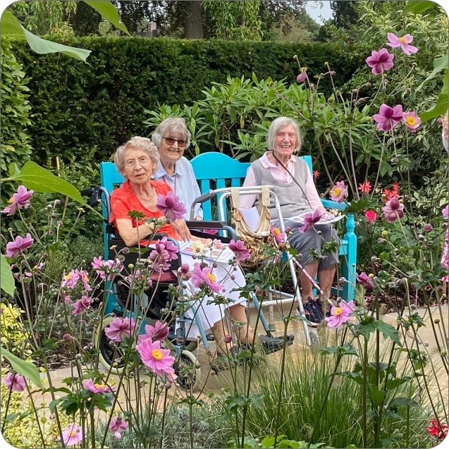 Summerlands | two of our residents sat outside in our gardens enjoying the summer sun