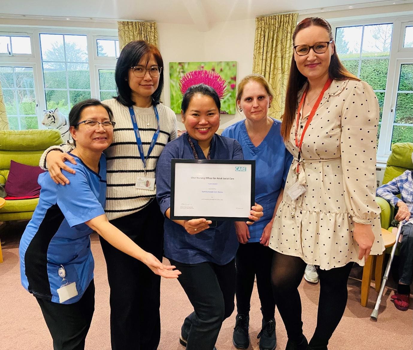 Summerlands | image showing members of staff holding certificate